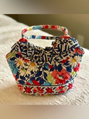 Vera Bradley Small Blue and Red Floral Ruffle Handbag with a snap closure.